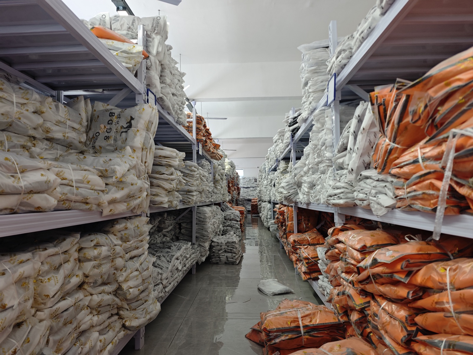 Shelves holding packed finished bags in the factory storage area
